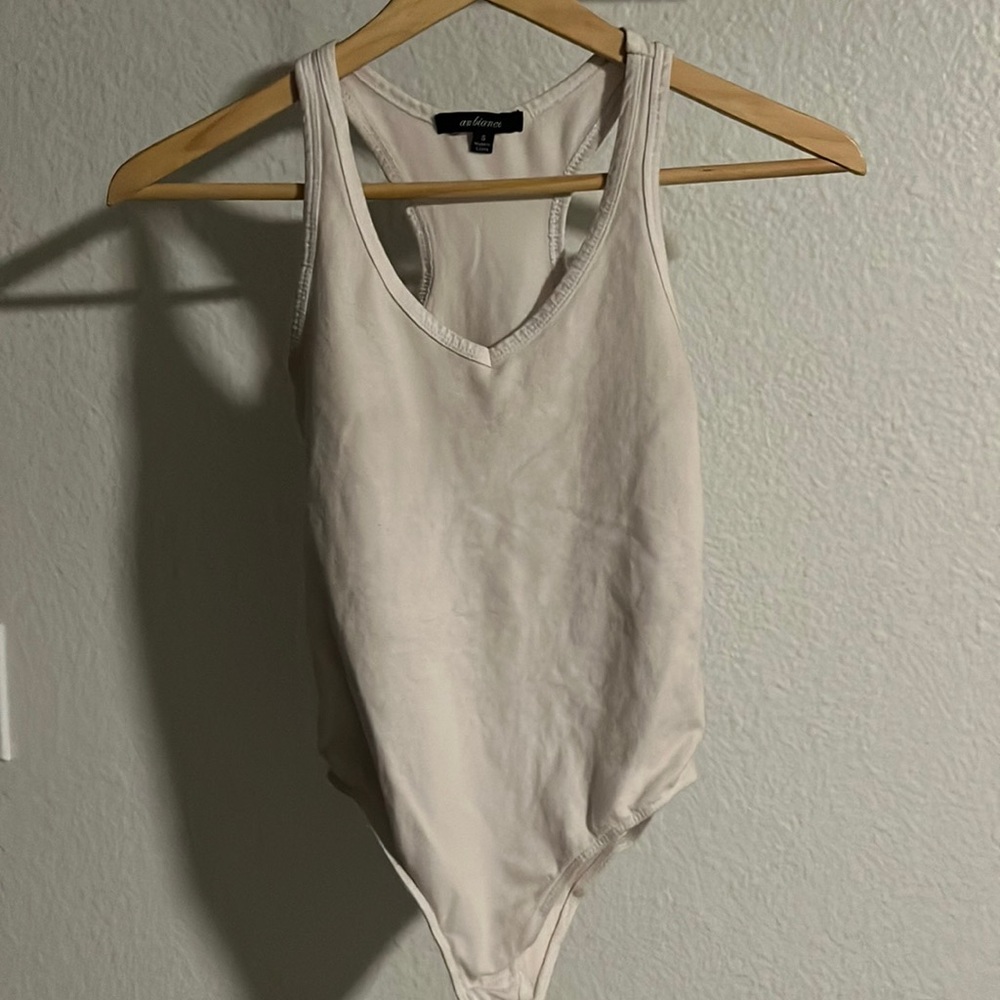 Razor back, white, body suit. Tank top. Lightly worn.